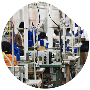 close-up of sewing machines with blue yarn